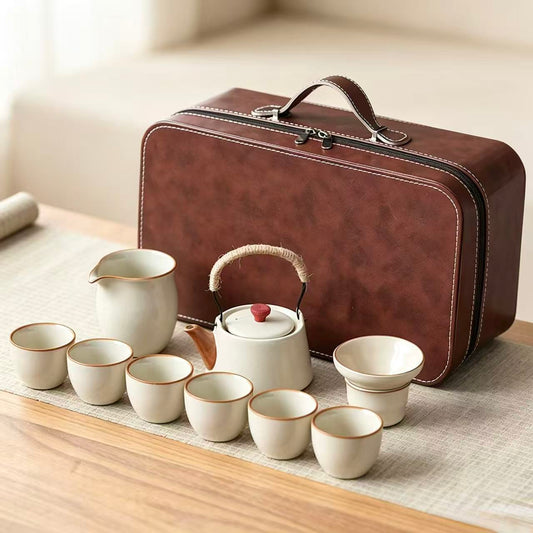 Still Ataraxia Ru Kiln side-handle teapot set in Bean Yellow with travel case